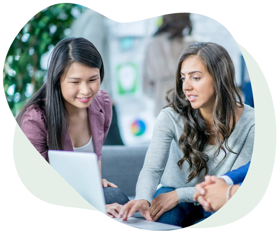 Two women looking at computer